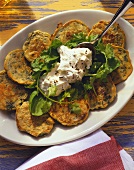 Spinach & herb flat bread with cream cheese on white platter