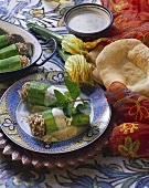 Courgettes with rice stuffing & yoghurt sauce; flat bread