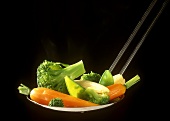 Steamed vegetables on a ladle