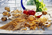 Still life: wholemeal pasta, egg, fruit, vegetables, milk etc