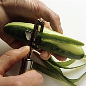 Peeling a cucumber