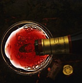 Red wine being poured into a glass