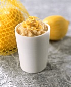 Lemon rice pudding with lemon zest in a glass