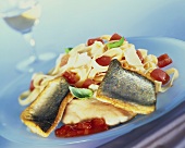 Fried brook trout with pasta with tomatoes and basil