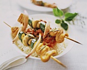 Kebabs with turkey and vegetables on rice