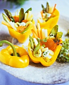 Steamed spring vegetables in yellow peppers