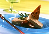 Goose liver pate with cherries and slice of bread