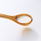 Crème fraiche on a wooden spoon