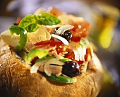 Salade nicoise in hollowed-out loaf
