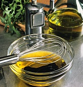 Olive oil with balsamic vinegar in glass bowl