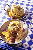 Baked apple with flaked almonds and fruit
