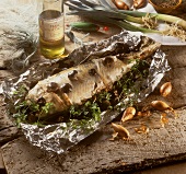 Trout cooked in foil with mushrooms and parsley