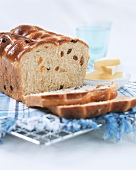 Yeast cake with raisins (slices cut); butter