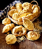Assorted cheese biscuits, some in bread basket