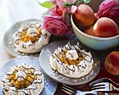 Meringue tart with apricots; roses; fresh apricots