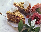Plum and almond cake with cream; decoration: flowers