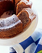 Spiced nut ring with icing sugar on cake plate