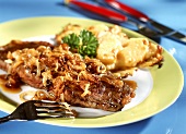 Steak with onions with cheese triangles