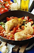 Chicken legs with tomatoes and spring onions