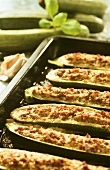 Stuffed courgettes on baking tray