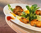 Baked ceps with lettuce and edible flowers