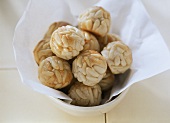 Pignolis: marzipan balls with pine nuts in bowl