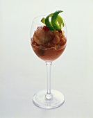 Berry sorbet with lime peel in glass