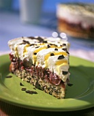 Piece of advocaat and cherry gateau with grated chocolate