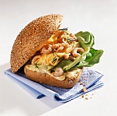 Roll with shrimp scrambled egg and lettuce leaves
