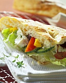 Flatbread filled with vegetables, salad & sheep's cheese