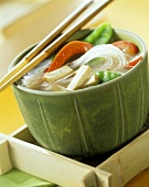 Hot and sour glass noodle soup with vegetables and tofu