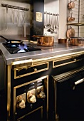Kitchen with gas cooker and copper pans