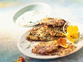Herb pancake with edible flowers and herb quark