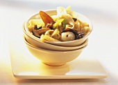 Rice ribbon noodles with mushrooms, fruit and nuts