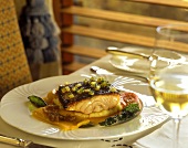 Barbecued coral trout on laid table