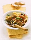 Fusilli with meatballs, tomatoes and olives