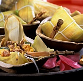 Tamales (maize leaves stuffed with meat and polenta)