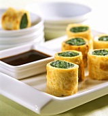 Tamgago maki: egg rolls with spinach filling and soy sauce