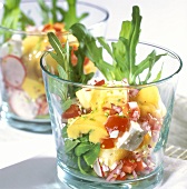 Cheese salad with rocket in glasses