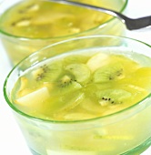 Green fruit compote with kiwis in glass bowls