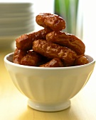 Cocktail sausages in white bowl