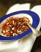 Tomato and onion salad with olives and parsley