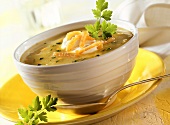 Potato soup with salmon and sour cream in soup bowl