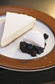 Piece of cheesecake and yoghurt mousse on compote