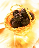 Lemon grass truffles in candied orange basket