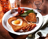 Toast heart with fried egg and bacon
