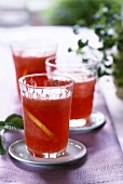 Strawberry lemonade with lemon slices in glasses
