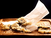 Truffle tempura with paper on wicker tray