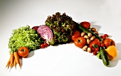 Fresh vegetables and salads arranged in an arc