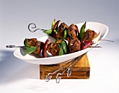 Spicy lamb kebabs with peppers and onions